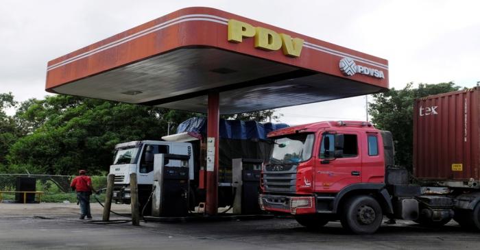 FILE PHOTO: The corporate logo of Venezuelan state-owned oil company PDVSA is seen at a gas