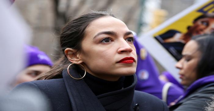 FILE PHOTO: Rep. Alexandria Ocasio-Cortez looks on during a march organised by the Women's