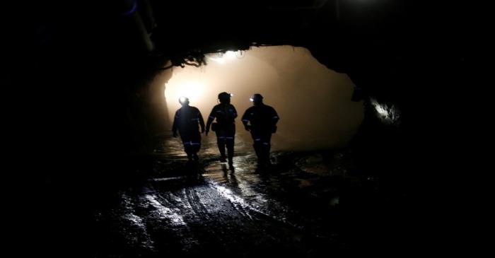 FILE PHOTO: Mine workers are seen under ground at Cullinan mine, near Pretoria