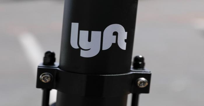 An electric scooter from the ride sharing company Lyft is shown on a downtown sidewalk in San