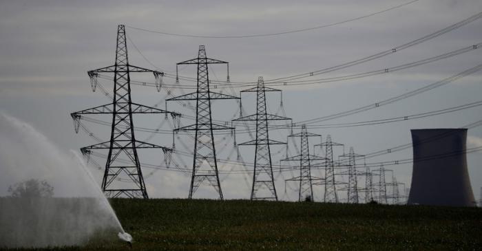 FILE PHOTO: Electricity pylons and a cooling tower from Eggborough power station are seen above
