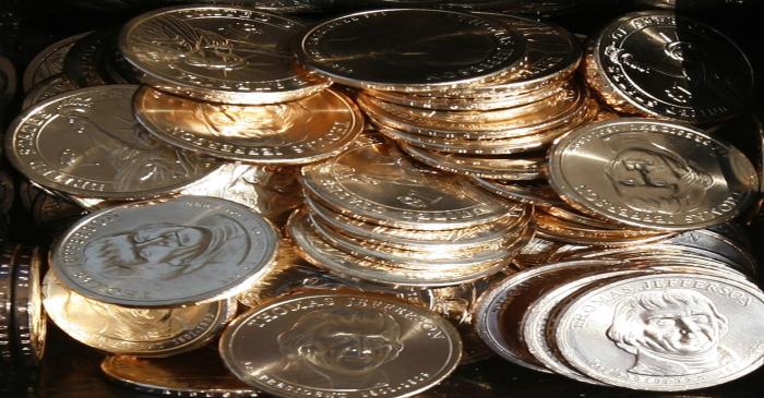 A pile of newly minted one dollar coins honoring former U.S. President Thomas Jefferson are