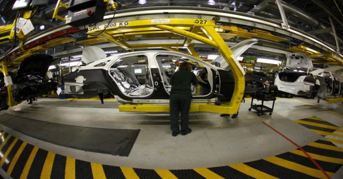 Staff work on the Jaguar XJ production line at their Castle Bromwich Assembly Plant in