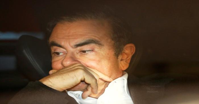 FILE PHOTO: Former Nissan Motor Chairman Carlos Ghosn sits inside a car as he leaves his