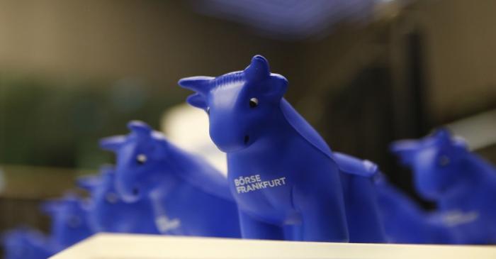 Styrofoam bull figures stand on a counter on the trading floor at the stock exchange in