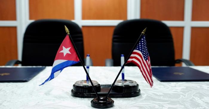 FILE PHOTO: A view of the U.S. and Cuban flags prior to the signing of agreements between the