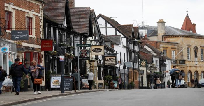 Visitors and shoppers walk along Sheep street in the centre of Stratford-upon-Avon