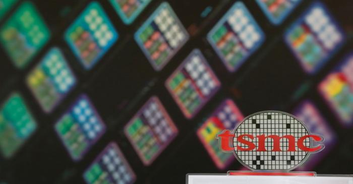 FILE PHOTO: A logo of Taiwan Semiconductor Manufacturing Co (TSMC) is seen at its headquarters
