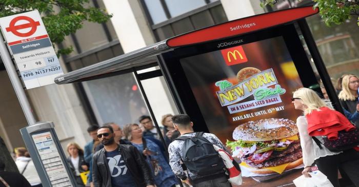 An electronic advertisement for a McDonalds food is seen at a bus stop on Oxford Street in