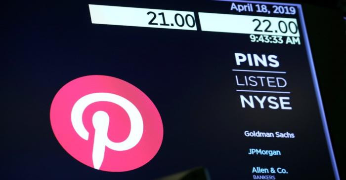 The company logo for Pinterest, Inc. with trading information is displayed on a screen at the