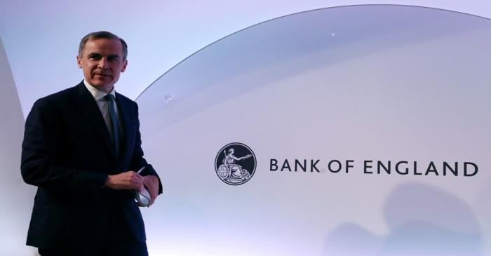 The Governor of the Bank of England, Mark Carney leaves after a news conference at the Bank of