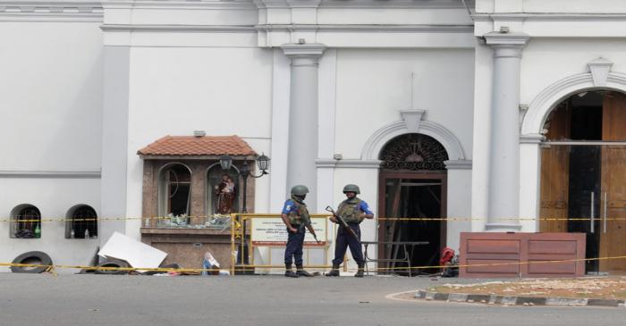 Security personnel stand guard outside St. Anthony Shrine in Colombo
