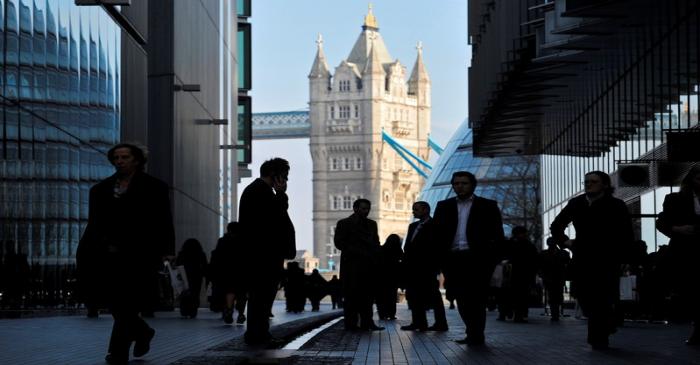 FILE PHOTO - Office workers are seen in the London Place business district near Tower Bridge in