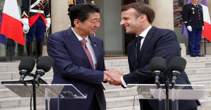 French President Emmanuel Macron and Japan's Prime Minister Shinzo Abe give a joint statement