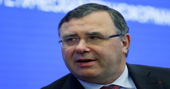 FILE PHOTO: Total CEO Pouyanne attends a session of the St. Petersburg International Economic