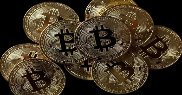 A collection of Bitcoin (virtual currency) tokens are displayed in this picture illustration