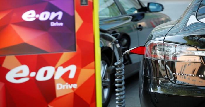 Electric car is charged at the charging station at the front of the German utility E.ON's