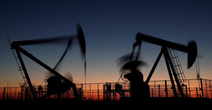 FILE PHOTO - Oil pumps are seen after sunset outside Vaudoy-en-Brie