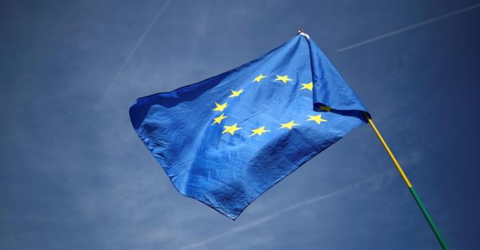An EU flag flutters outside the Houses of Parliament in London