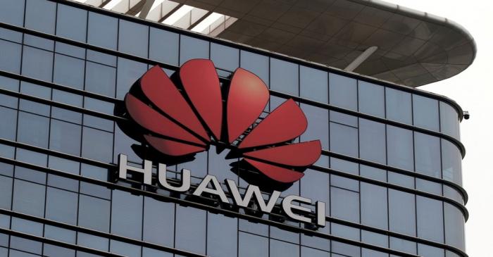 FILE PHOTO: The Huawei logo is pictured outside its Huawei's factory campus in Dongguan,