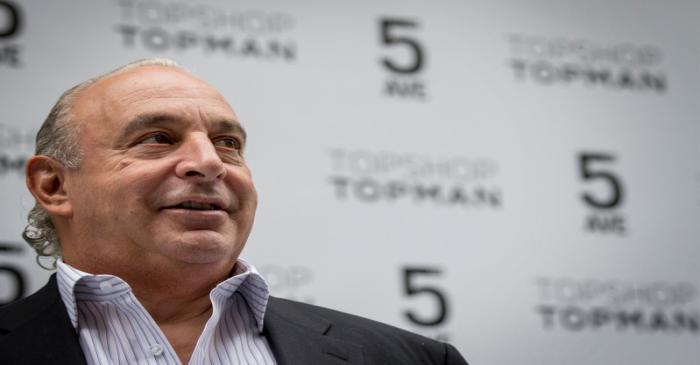 CEO Philip Green of Britain's retail clothing store Topshop poses before opening the chain's