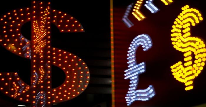 FILE PHOTO: Dollar signs are seen alongside the signs for other currencies at a currency