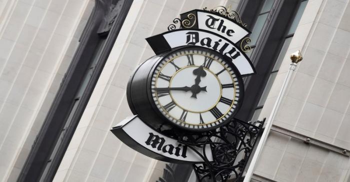 FILE PHOTO: A clock face is seen outside of the London offices of the Daily Mail newspaper in