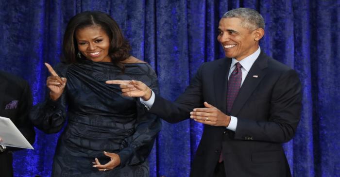 Former U.S. President Barack Obama and former first lady Michelle Obama attend their portrait