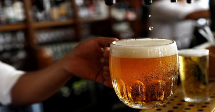 FILE PHOTO: A pint of beer is poured into a glass in a bar in London