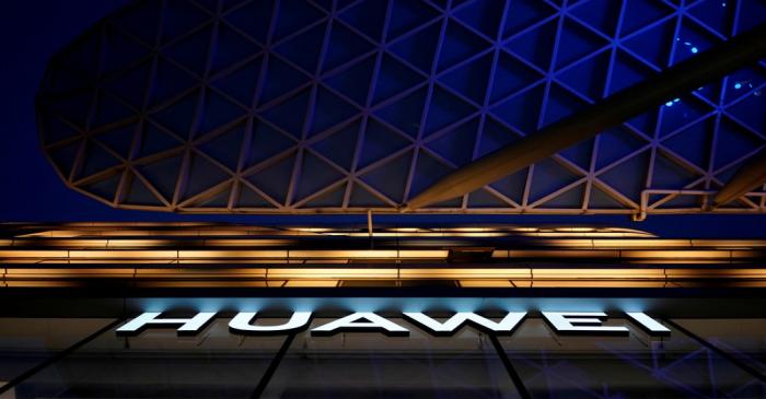 FILE PHOTO: A Huawei company logo is seen at a shopping mall in Shanghai