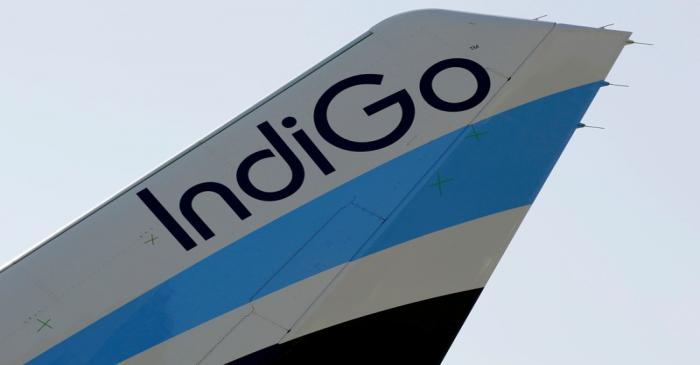 FILE PHOTO: A logo of IndiGo Airlines is pictured on passenger aircraft on the tarmac in