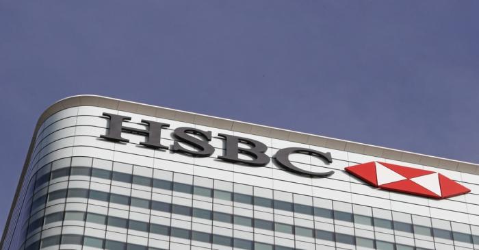 The HSBC logo is seen at their offices at Canary Wharf financial district in London