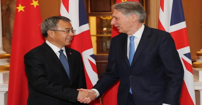 British Chancellor of the Exchequer Philip Hammond and Chinese Vice-Premier Hu Chunhua shake