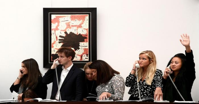FILE PHOTO: Employees take telephone bids during a contemporary art day auction at Sotheby's in