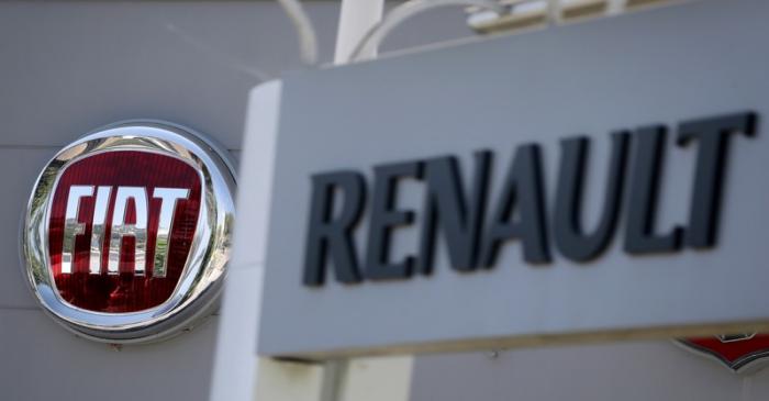 FILE PHOTO: The logos of Renault and Fiat carmakers are seen in Nice