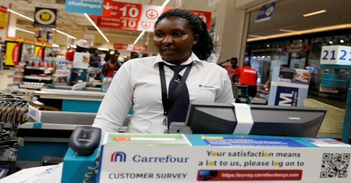 FILE PHOTO: A worker serves a customer inside the Carrefour hypermarket at the Two Rivers