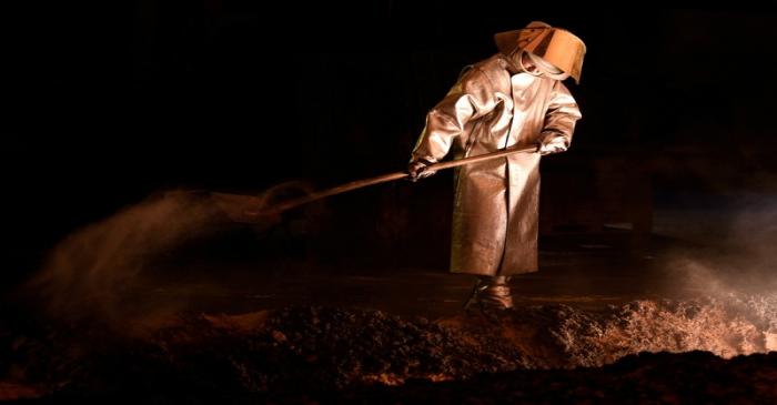 FILE PHOTO: A steel-worker is pictured at a furnace at the plant of German steel company