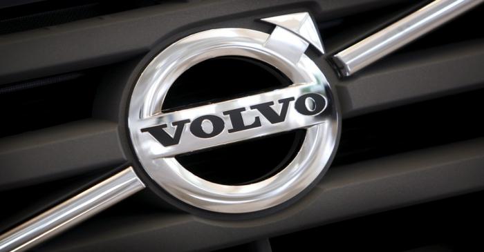 Logo of Volvo on the front grill of a Volvo truck in a customer showroom at the company's