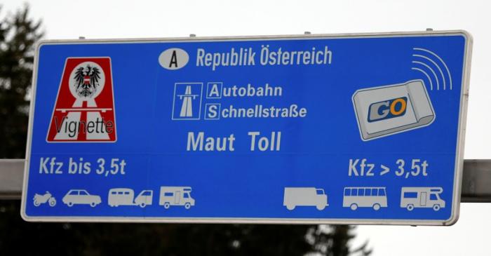 FILE PHOTO: A sign advertising the sale of Austrian motorway road toll stickers is seen on the