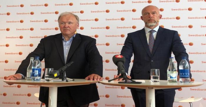Former Swedish PM Persson and acting Swedbank CEO Karlsson make a statement in Stockholm