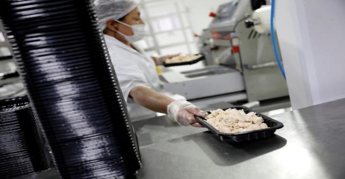 Employer packs vegan chicken at Superbom factory in Sao Paulo
