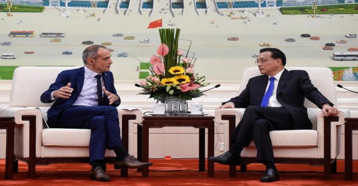 Chinese Premier Li Keqiang talks with Chairman and CEO of Schneider Electric Jean Pascal