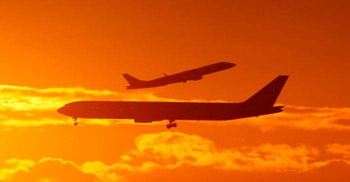 FILE PHOTO: Passenger planes land and take off at Sydney airport