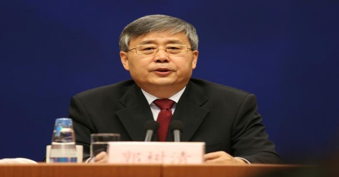 FILE PHOTO: Guo Shuqing, China's newly appointed banking regulator, attends a news conference