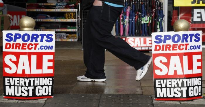 File photo of a pedestrian walking past a branch of Sports Direct in Liverpool