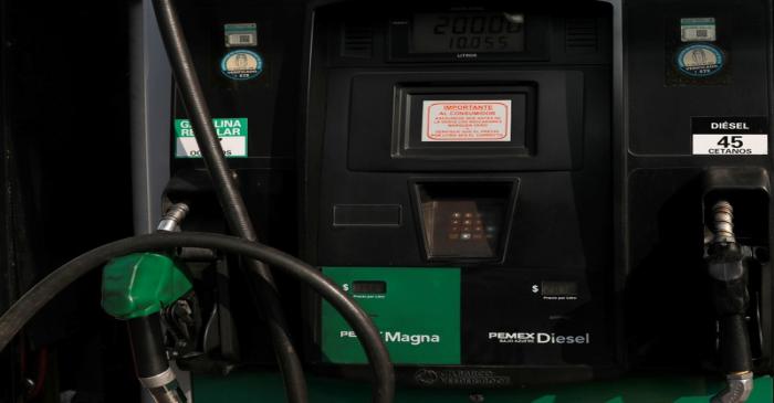 A diesel and fuel pump machine are seen at a gas station, in Mexico City