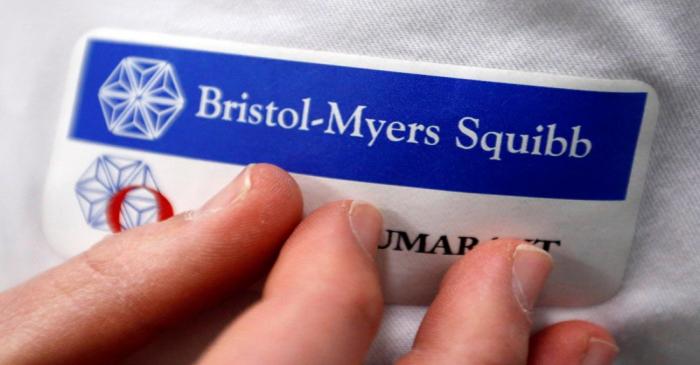 Logo of global biopharmaceutical company Bristol-Myers Squibb is pictured on the blouse of an