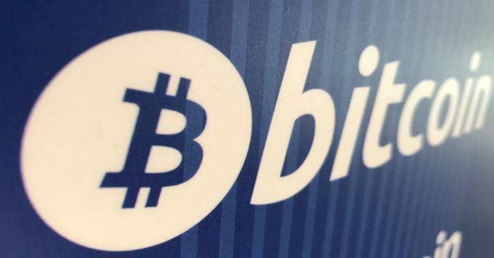 FILE PHOTO: A Bitcoin logo is seen on a cryptocurrency ATM in Santa Monica