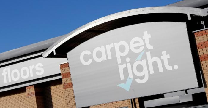 A sign hangs above the door of a Carpetright store in Derby