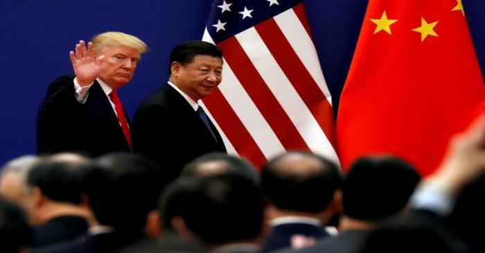 FILE PHOTO: U.S. President Donald Trump and China's President Xi Jinping meet business leaders